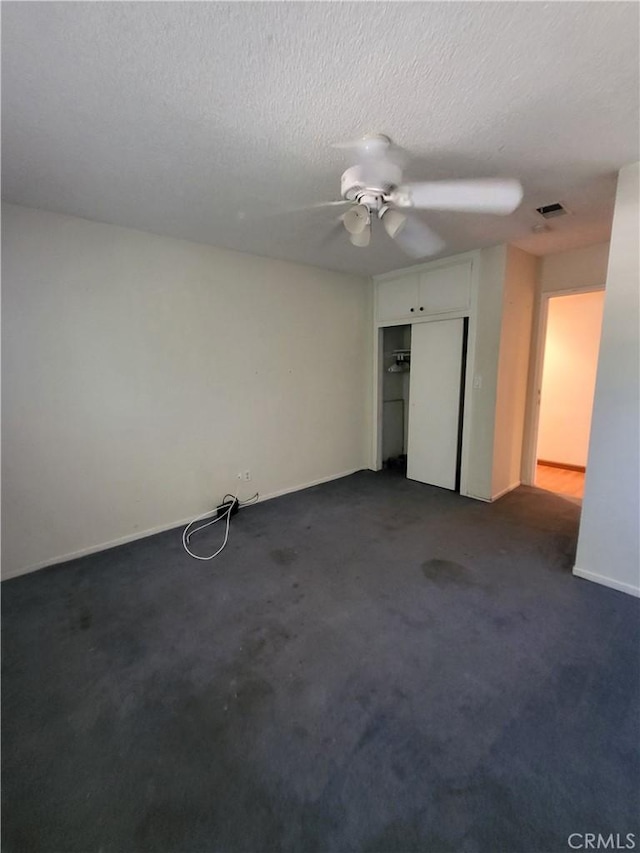 4322 Temescal Ave, Norco, CA 92860 - unfurnished bedroom featuring dark carpet, a closet, ceiling fan, a textured ceiling, and baseboards