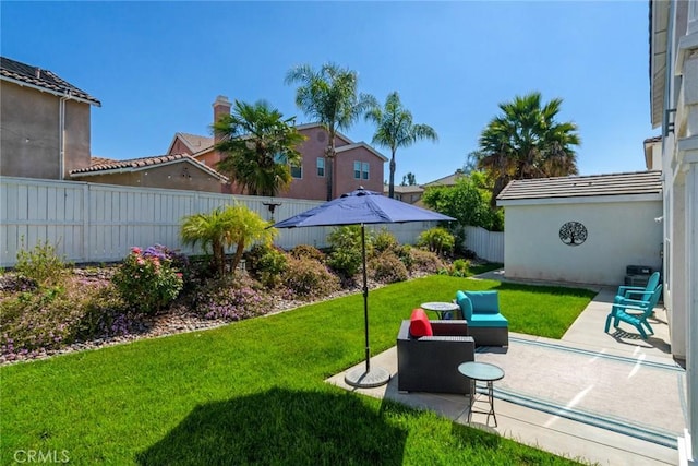 view of yard featuring a patio and a fenced backyard