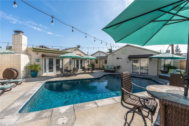 4045 N Walnuthaven Dr, Covina, CA 91722 - view of pool featuring a patio area, outdoor dining space, a fenced in pool, and french doors
