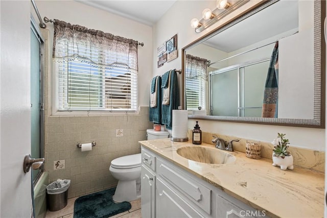 4045 N Walnuthaven Dr, Covina, CA 91722 - full bathroom featuring tile walls, tile patterned flooring, vanity, and toilet