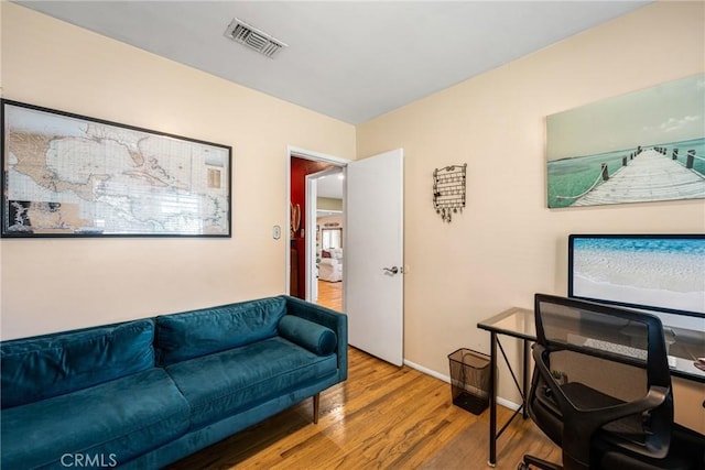 4045 N Walnuthaven Dr, Covina, CA 91722 - office with baseboards, wood finished floors, and visible vents