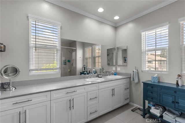 full bathroom with a stall shower, a sink, and a healthy amount of sunlight