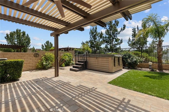 view of patio / terrace with a fenced backyard, a hot tub, and a pergola