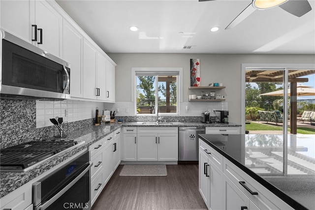 kitchen featuring recessed lighting, a sink, stainless steel appliances, and decorative backsplash