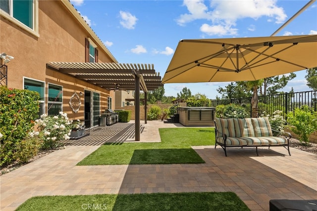 view of patio / terrace with a pergola, a fenced backyard, and a hot tub