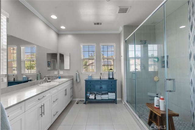 full bath featuring tile patterned floors, vanity, baseboards, visible vents, and crown molding