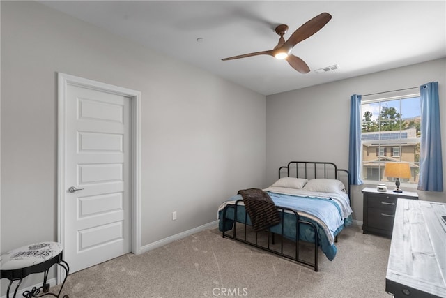 bedroom featuring visible vents, ceiling fan, carpet flooring, and baseboards