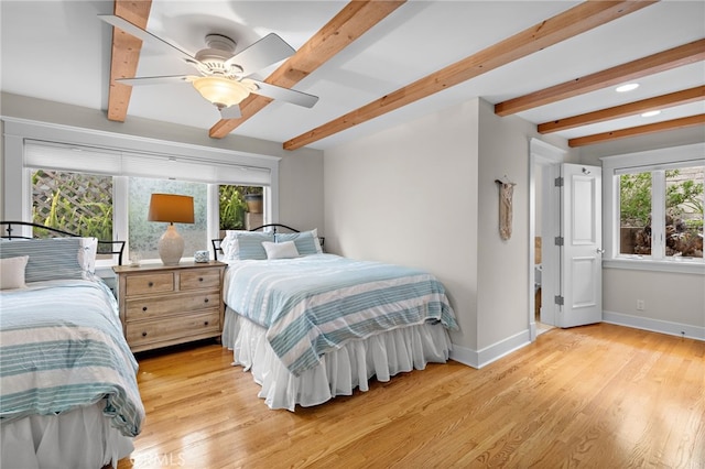 522 High Dr, Laguna Beach, CA 92651 - bedroom featuring beamed ceiling, baseboards, light wood finished floors, and ceiling fan