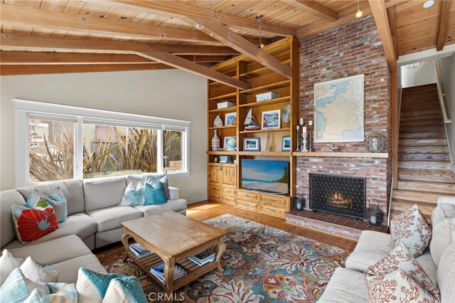 522 High Dr, Laguna Beach, CA 92651 - living area with wooden ceiling, wood finished floors, a brick fireplace, baseboards, and built in features