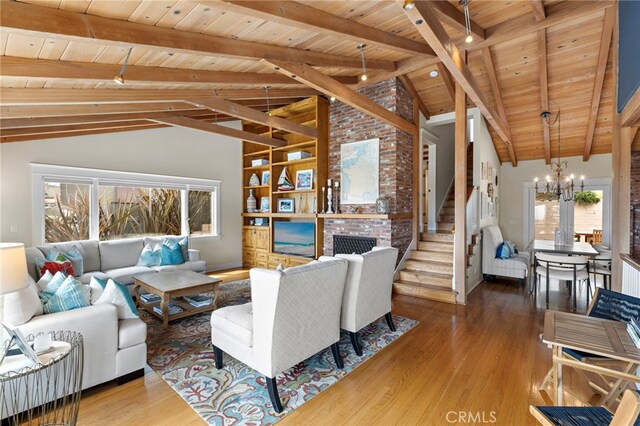 522 High Dr, Laguna Beach, CA 92651 - living room with wood ceiling, a chandelier, plenty of natural light, beamed ceiling, and stairs