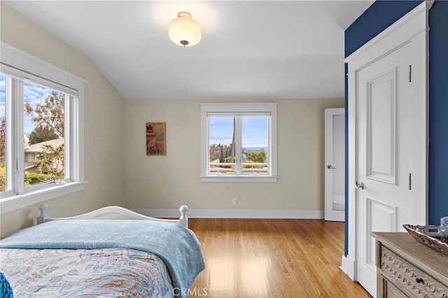 522 High Dr, Laguna Beach, CA 92651 - bedroom featuring multiple windows, lofted ceiling, and light wood finished floors