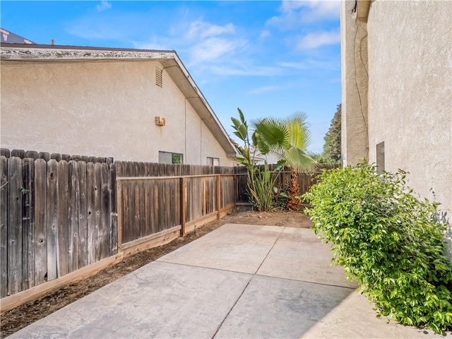 1523 E Pryor Dr, Fresno, CA 93720 - view of property exterior with a patio, a fenced backyard, and stucco siding