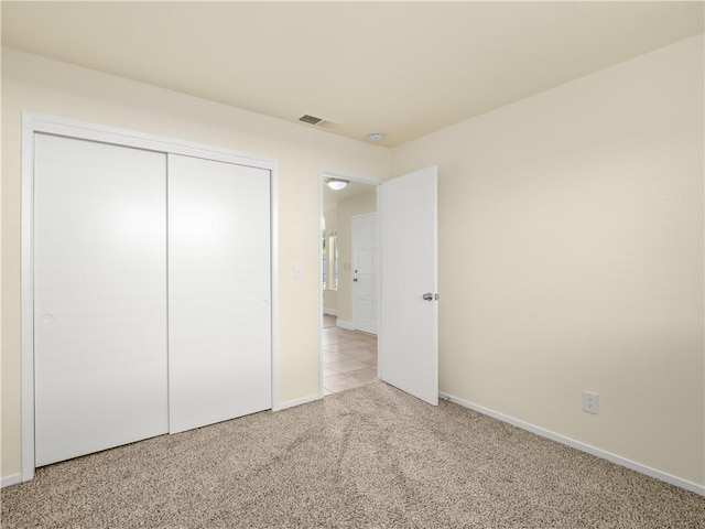 1523 E Pryor Dr, Fresno, CA 93720 - unfurnished bedroom featuring baseboards, visible vents, a closet, and carpet flooring
