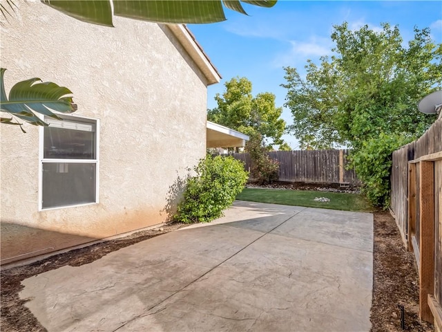 1523 E Pryor Dr, Fresno, CA 93720 - exterior space with a patio area, a fenced backyard, and stucco siding