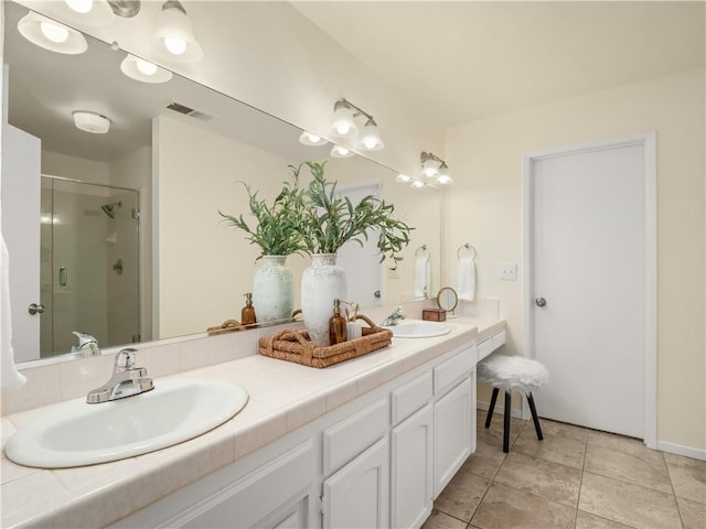 1523 E Pryor Dr, Fresno, CA 93720 - bathroom featuring a shower stall, visible vents, a sink, and double vanity