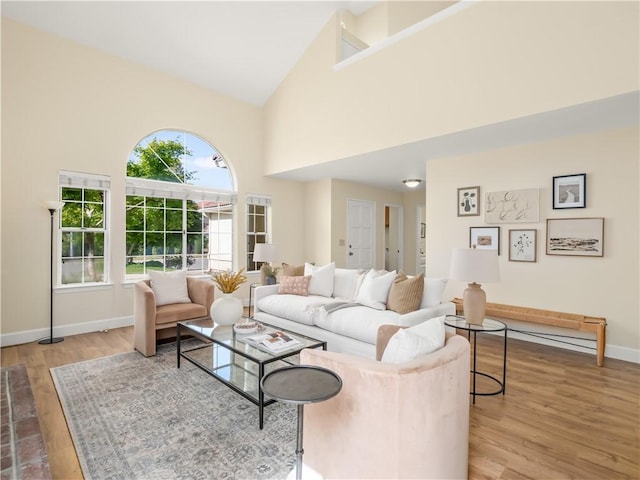 1523 E Pryor Dr, Fresno, CA 93720 - living room featuring light wood-type flooring, baseboards, and high vaulted ceiling