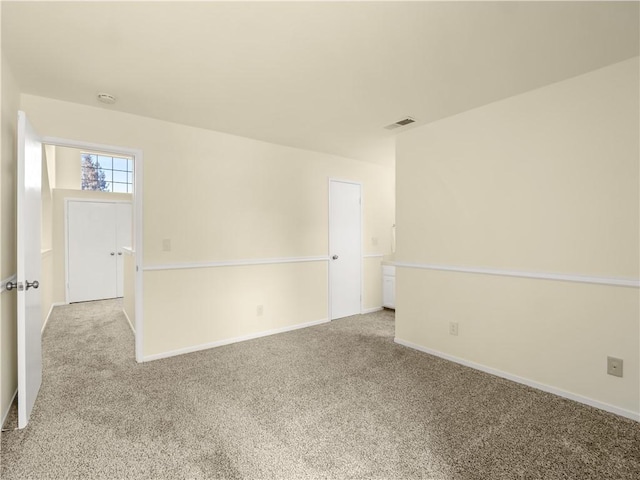 1523 E Pryor Dr, Fresno, CA 93720 - empty room featuring baseboards, visible vents, and light colored carpet