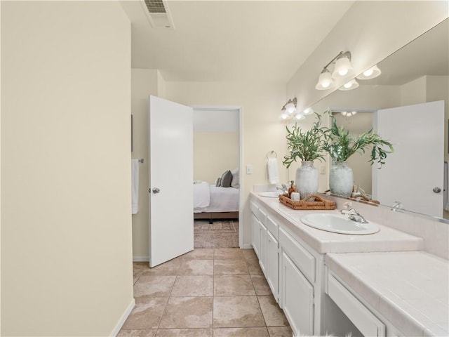 1523 E Pryor Dr, Fresno, CA 93720 - ensuite bathroom with ensuite bath, visible vents, a sink, and double vanity