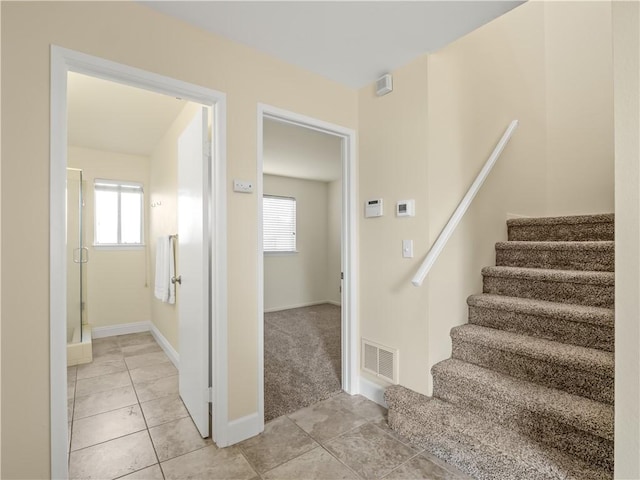 1523 E Pryor Dr, Fresno, CA 93720 - stairs with tile patterned flooring, baseboards, visible vents, and a wealth of natural light