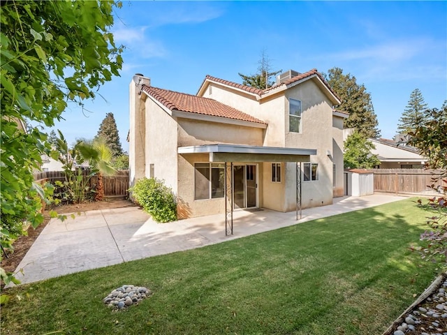 1523 E Pryor Dr, Fresno, CA 93720 - rear view of property with stucco siding, a patio area, a yard, and a fenced backyard