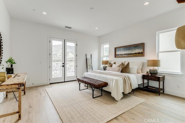 bedroom featuring light wood-type flooring, recessed lighting, baseboards, and access to exterior