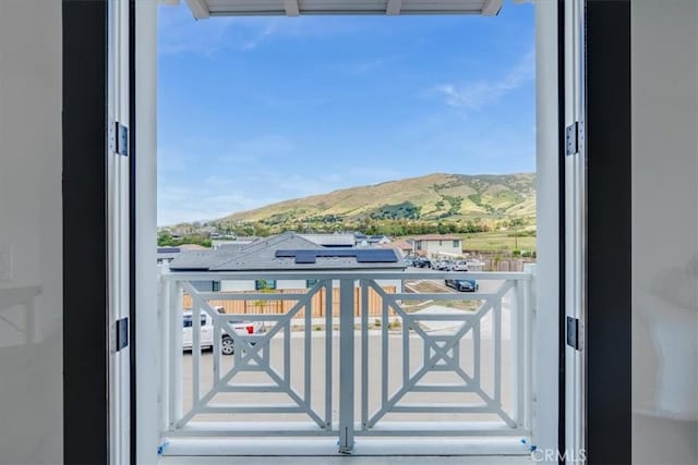 balcony featuring a mountain view