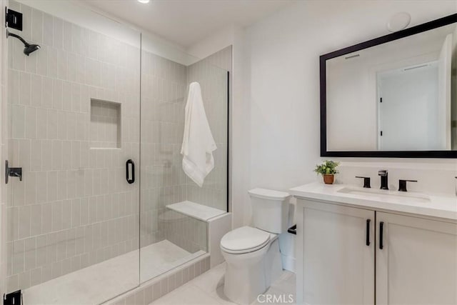 full bathroom with vanity, tile patterned floors, a stall shower, and toilet