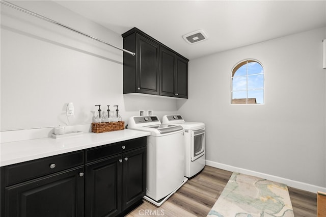 3693 S Grower Ave, Ontario, CA 91761 - clothes washing area with cabinet space, light wood-type flooring, visible vents, and separate washer and dryer