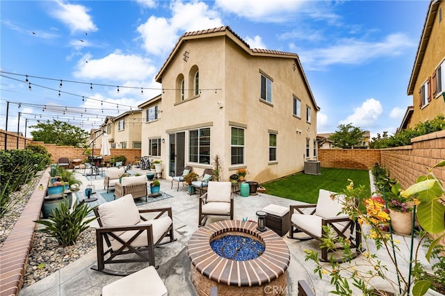 3693 S Grower Ave, Ontario, CA 91761 - rear view of house featuring stucco siding, a patio area, an outdoor living space with a fire pit, and a fenced backyard