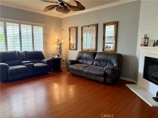 10485 Nobleton Rd, Apple Valley, CA 92308 - living area with a glass covered fireplace, crown molding, wood finished floors, and a ceiling fan