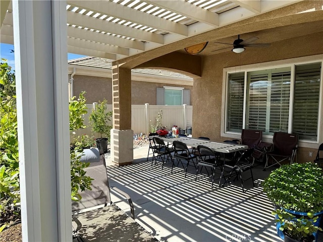 10485 Nobleton Rd, Apple Valley, CA 92308 - view of patio featuring a pergola, ceiling fan, outdoor dining space, and fence
