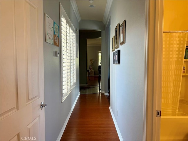 10485 Nobleton Rd, Apple Valley, CA 92308 - hall with dark wood finished floors, arched walkways, ornamental molding, and baseboards