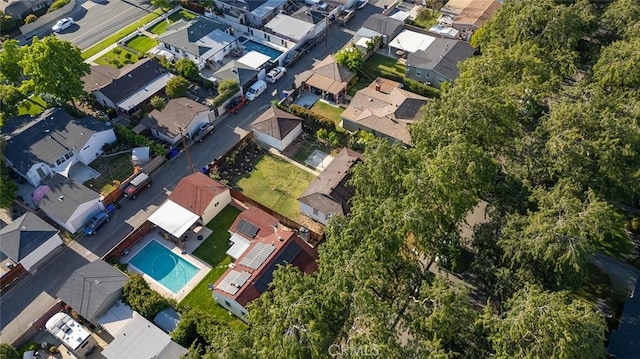 birds eye view of property with a residential view