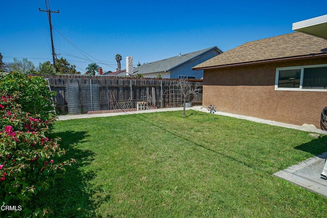 view of yard featuring fence private yard