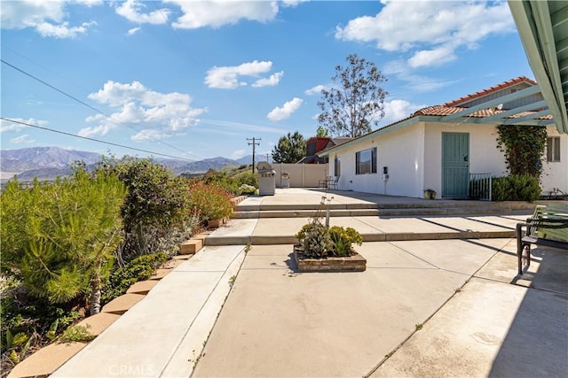 11485 Crafton, Mentone, CA 92359 - view of patio with a mountain view and fence