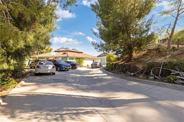 11485 Crafton, Mentone, CA 92359 - view of property hidden behind natural elements featuring uncovered parking