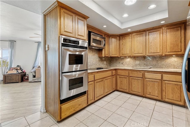 11485 Crafton, Mentone, CA 92359 - kitchen featuring stainless steel appliances, decorative backsplash, recessed lighting, light tile patterned floors, and light stone countertops