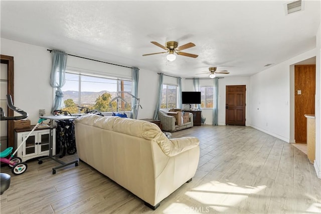 11485 Crafton, Mentone, CA 92359 - living area featuring a ceiling fan and light wood-style flooring