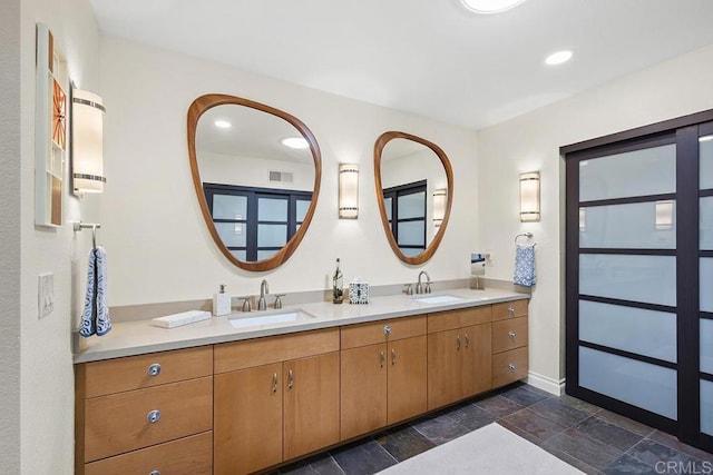 2406 Mcdougal Pl, Alpine, CA 91901 - bathroom with double vanity, stone tile floors, and recessed lighting