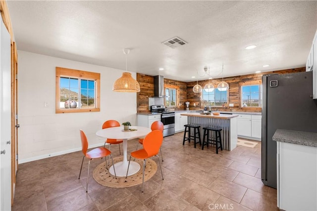 55850 Shannon Rd, Landers, CA 92285 - dining area featuring recessed lighting, a textured ceiling, visible vents, and baseboards