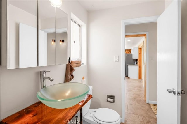 55850 Shannon Rd, Landers, CA 92285 - half bath with tile patterned floors, vanity, and toilet