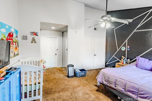 carpeted bedroom featuring visible vents and a towering ceiling