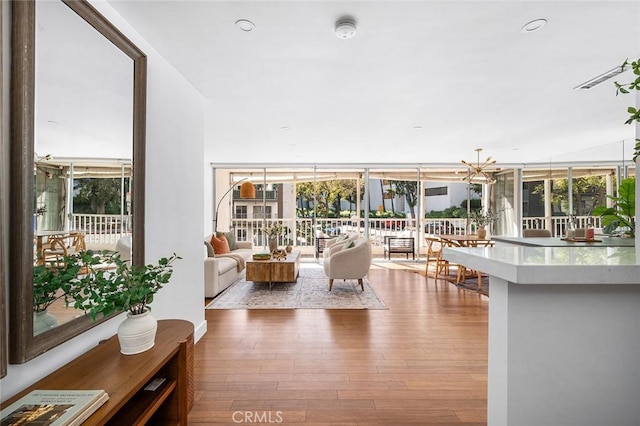 1400 N Sweetzer Ave Unit 102, West Hollywood, CA 90069 - living room with wood finished floors and a chandelier