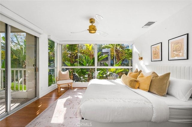 1400 N Sweetzer Ave Unit 102, West Hollywood, CA 90069 - bedroom with wood finished floors, ceiling fan, and access to exterior