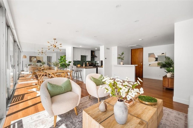 1400 N Sweetzer Ave Unit 102, West Hollywood, CA 90069 - living room featuring light wood-type flooring, baseboards, and recessed lighting