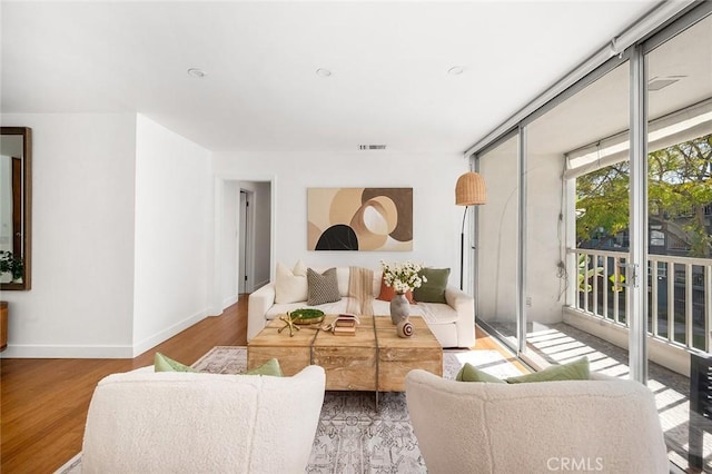 1400 N Sweetzer Ave Unit 102, West Hollywood, CA 90069 - living room featuring baseboards and wood finished floors