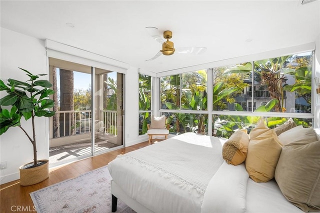 1400 N Sweetzer Ave Unit 102, West Hollywood, CA 90069 - bedroom with access to outside, wood finished floors, and a ceiling fan