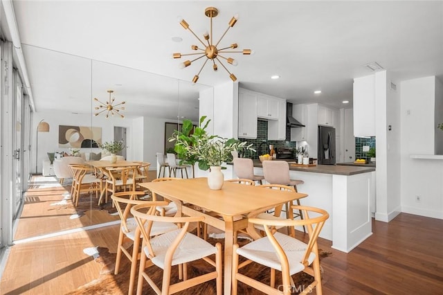 1400 N Sweetzer Ave Unit 102, West Hollywood, CA 90069 - dining space featuring a chandelier, light wood-style floors, recessed lighting, and baseboards