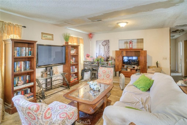 carpeted living area with a textured ceiling and visible vents