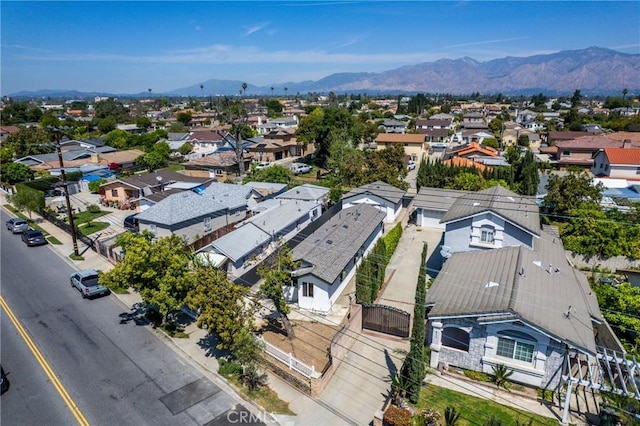 aerial view of residential area with a mountainous background